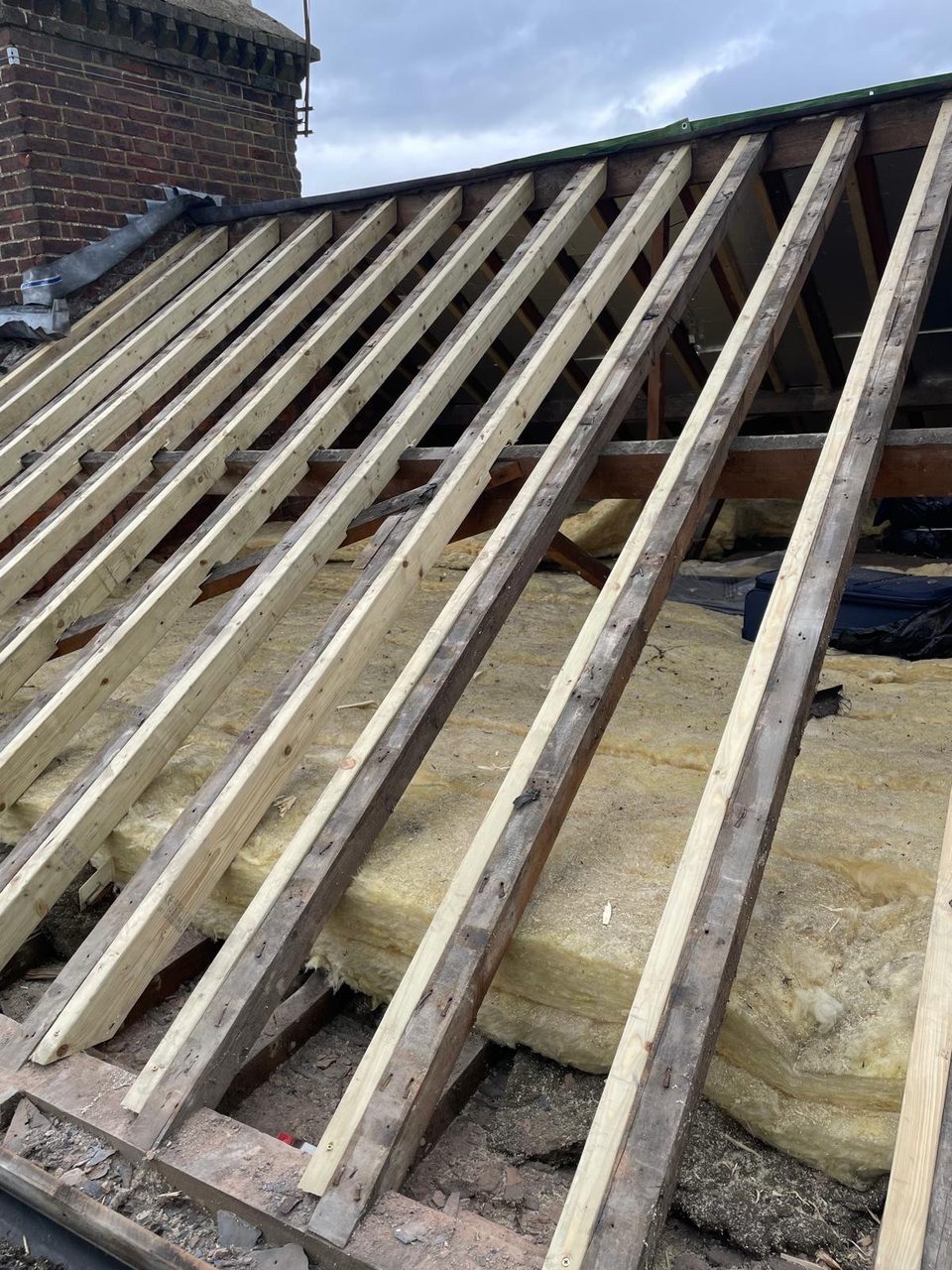 Roofing work in progress by All Pro Contractors