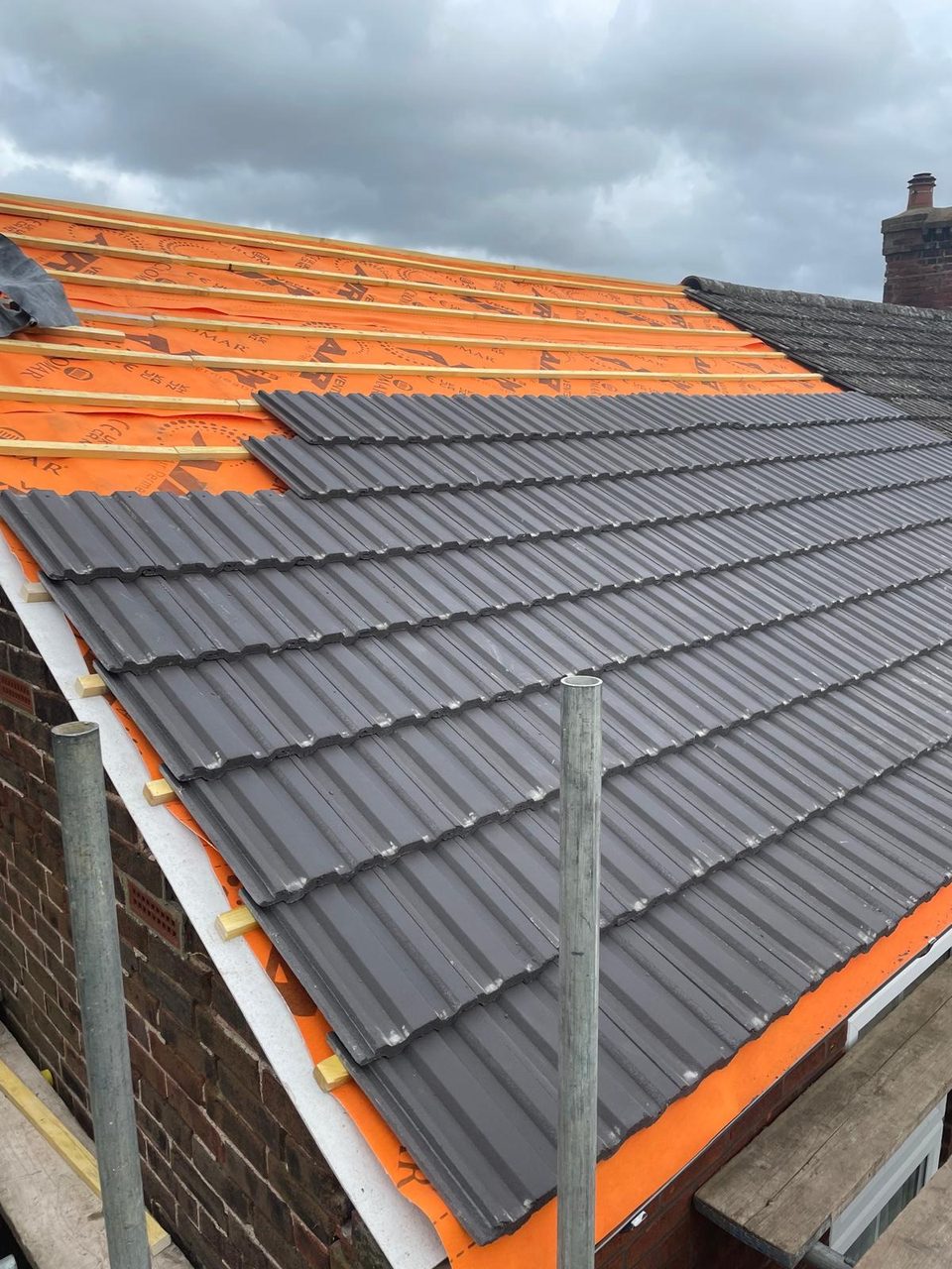 Roofing work in progress by All Pro Contractors