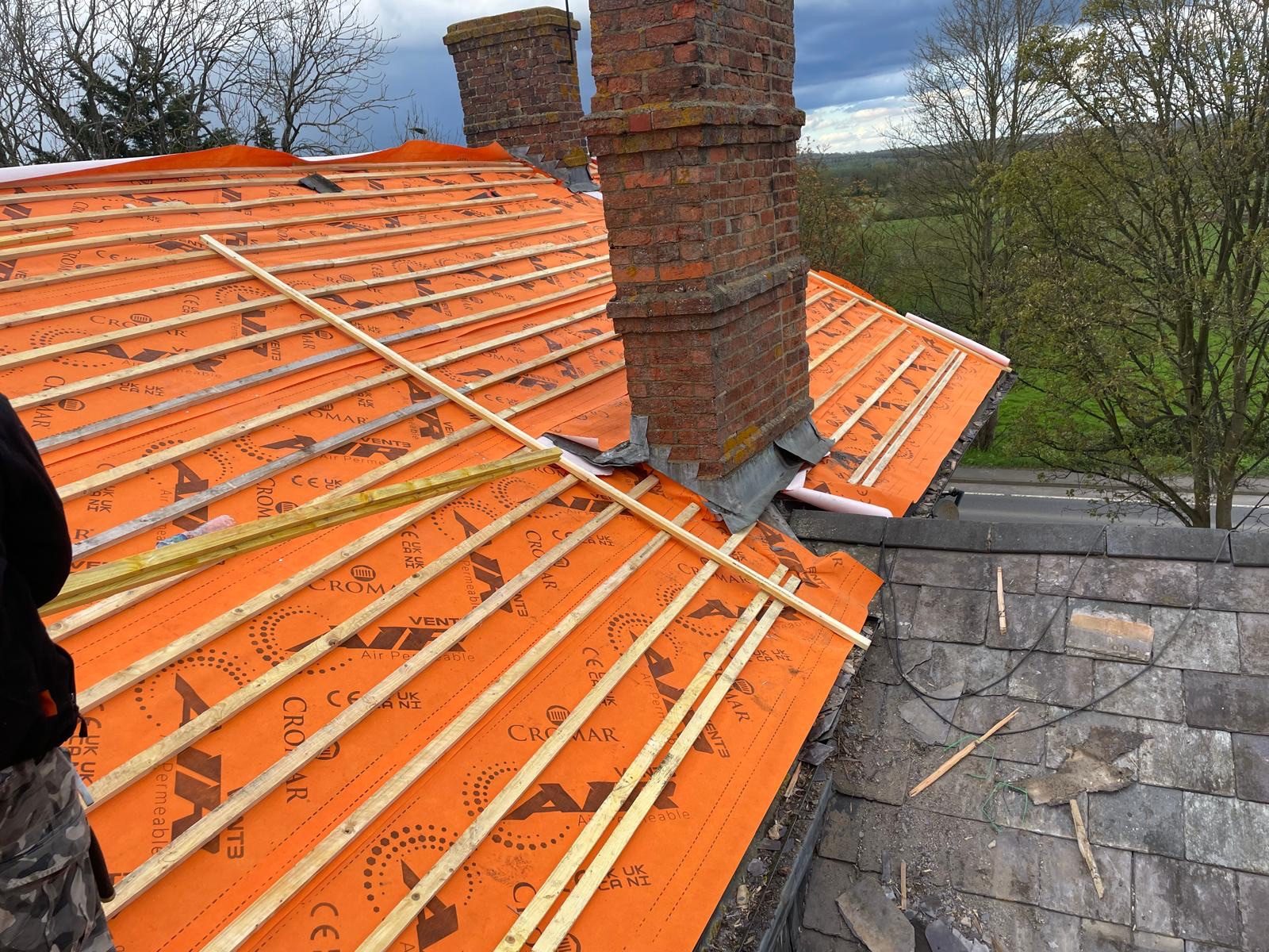 Roofing work in progress by All Pro Contractors