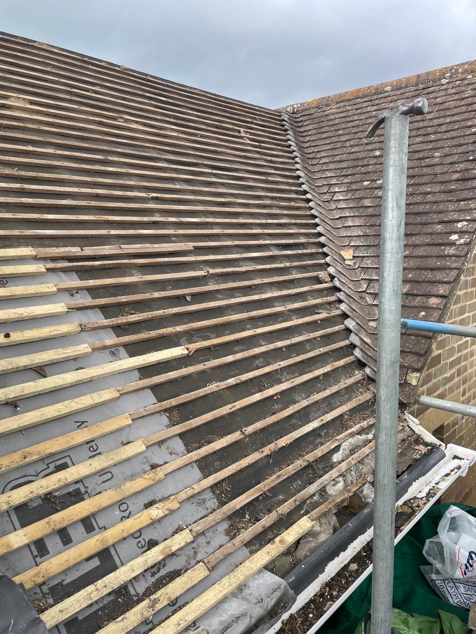 Roofing work in progress by All Pro Contractors